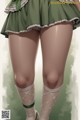 A woman in a green skirt and white stockings.