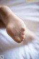 A close up of a person's foot with a bandage on it.